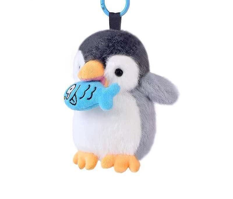 Penguin mascot plush keychain with a visible split ring and webbing loop